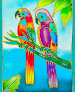 Batik uses melted wax as a resist; fabric is then painted with batik dyes - waxed areas will not be penetrable. Colours soak into the fabric in a magical way, swirling and glowing as they dry - and so these two parrots can continue talking, all day long!